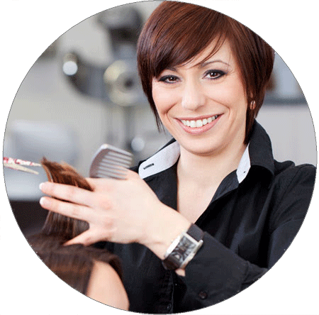 Woman smiling while cutting hair
